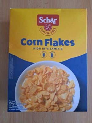 Scatola di Corn Flakes Schär con il simbolo della spiga barrata